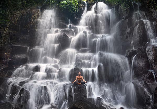 serenity and yoga practicing at waterfall Kanto Lampo, Bali,Indonesia By Глеб Шабашный