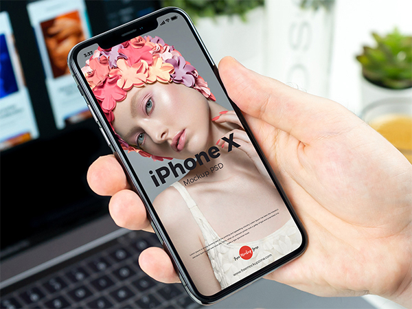 Free Man Holding in Hand iPhone X Mockup PSD